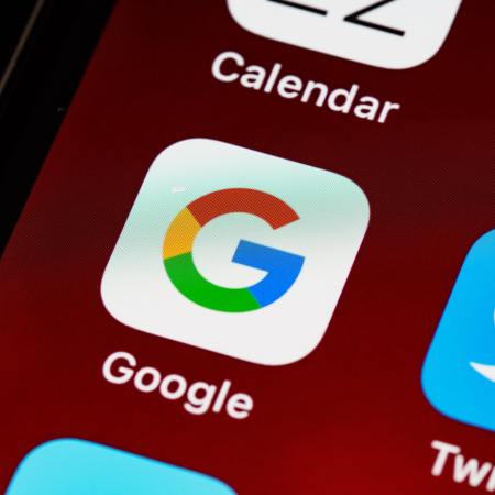 A closeup of the Google app icon on a smartphone screen.